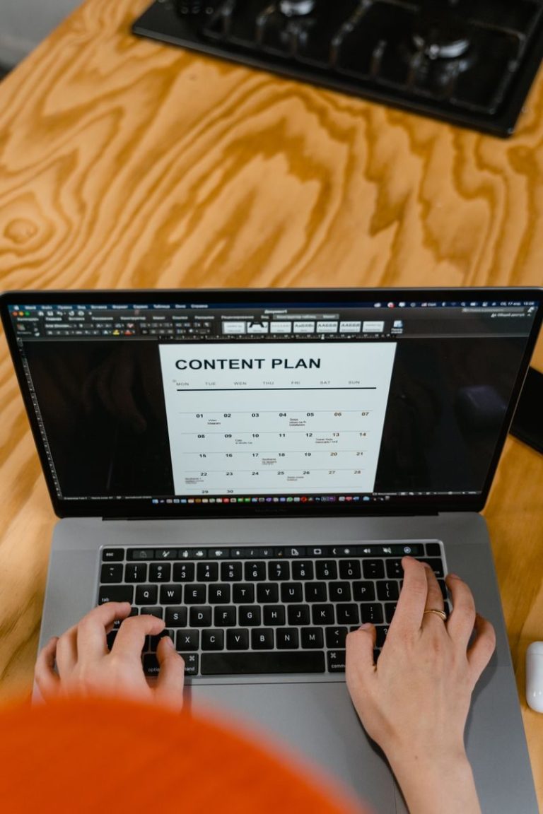 Person using AI-powered apps on a laptop to work smarter