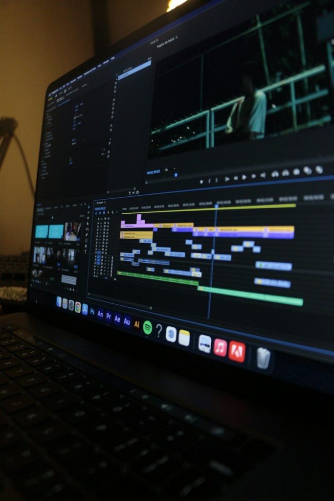 AI video editor generating automatic captions on a laptop screen