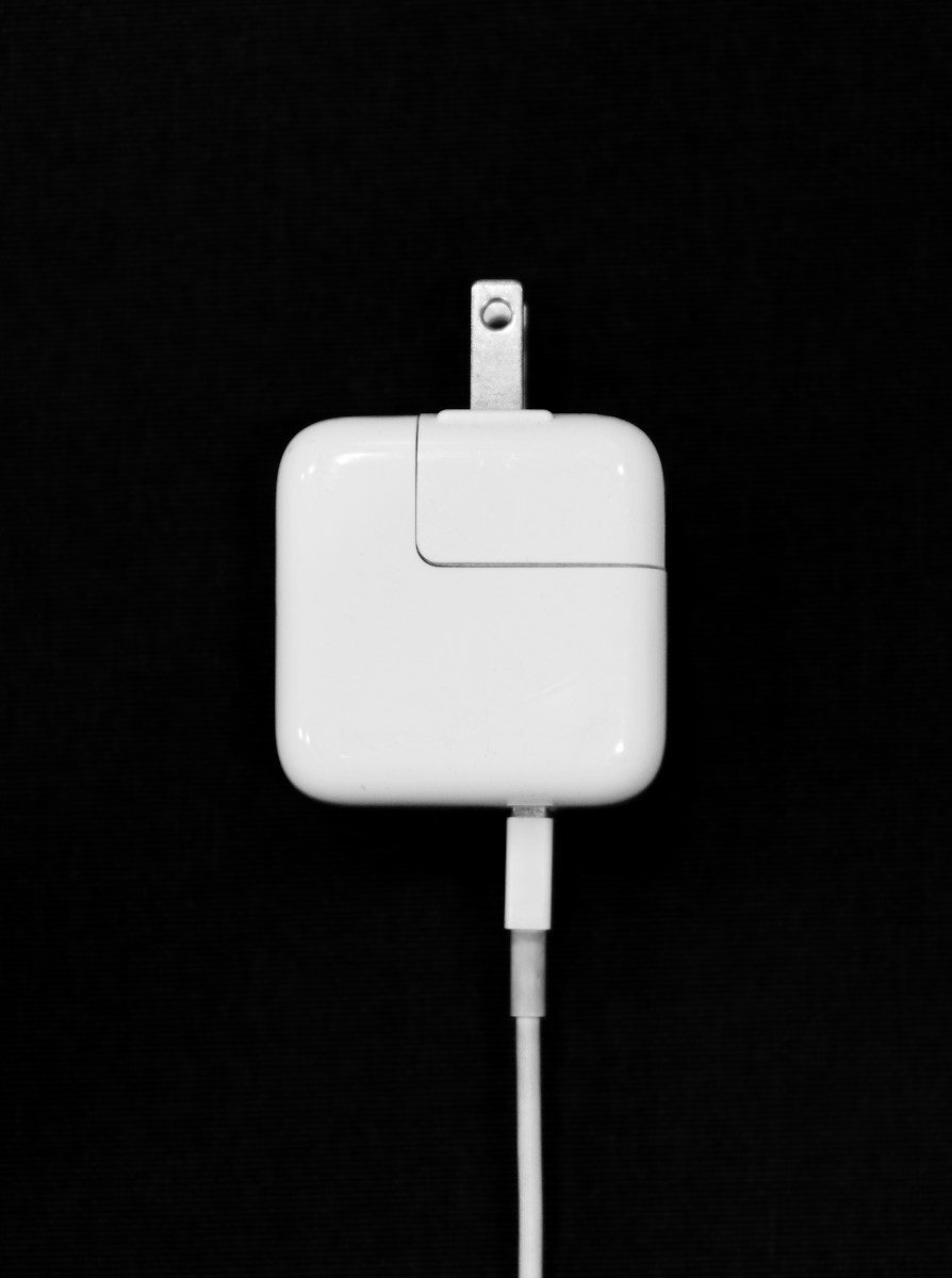Close-up of HP laptop charger label showing wattage specs and model number